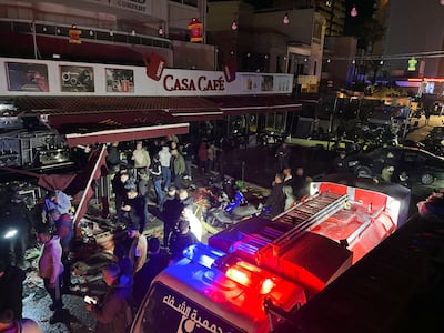 Emergency workers gather at the site of an Israeli strike on a vehicle in Sidon. AFP