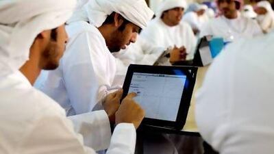 Uncluttered desks: students at Abu Dhabi Men's College use their iPads in class as the education authority prepares them to take on the cyberworld. Christopher Pike / The National