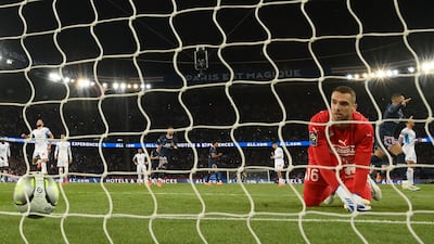 Marseille goalkeeper Pau López looks on after failing to stop Kylian Mbappe's penalty. AFP