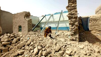 A boy roots the rubble of his home, in Awaran district of Pakistan's Baluchistan, where a second earthquake of 6.8 magnitude struck on Saturday after a 7.7-magnitude earthquake on September 24 in which hundreds of people were killed. Shahzaib Akber / EPA