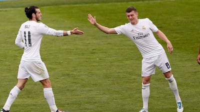 Real Madrid’s Welsh midfielder Gareth Bale (R) jubilates with his teammate, German midfielder Toni Kroos (R) his goal against Getafe FC during their La Liga match played at Coliseum Alfonso Perez stadium in Getafe, Madrid, Spain on 15 April 2016. EPA/JuanJo Martin