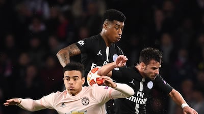 Manchester United forward Mason Greenwood, left, fights for the ball with Paris Saint-Germain's French defender Presnel Kimpembe. AFP