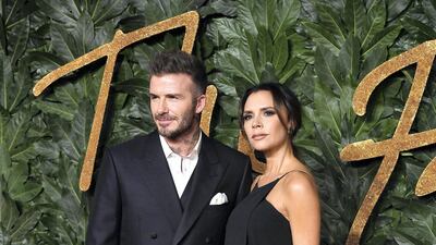 David Beckham and Victoria Beckham look chic in matching informal black. Getty