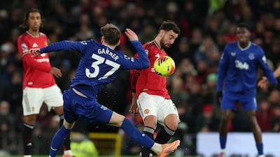 Manchester United's Bruno Fernandes in action with Everton's James Garner. Reuters