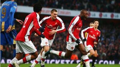 Happy days, such as William Gallas, second from the right, celebrating a goal with teammates in December 2008 was not the big reason Paul Oberjuerge picked Arsenal as his team.