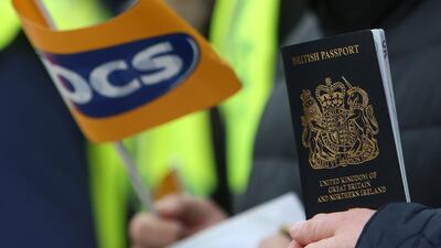 Members of the Public and Commercial Services union on a picket line at the start of a five-week strike by Passport Office workers in London on April 3. AFP