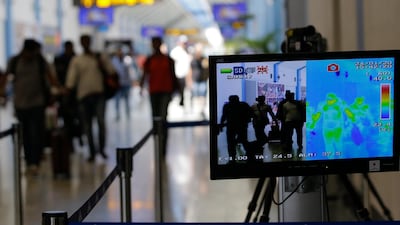 A thermal scanner shows the temperature of arriving passengers at Bandaranaike International Airport in Colombo, Sri Lanka. EPA