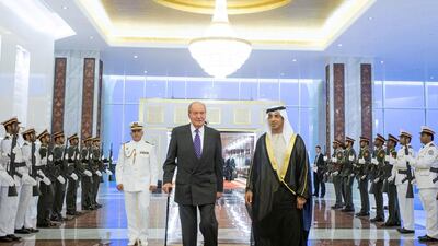 Sheikh Mansour bin Zayed Al Nahyan (right), UAE Deputy Prime Minister and Minister of Presidential Affairs, welcomes Spain's King Juan Carlos upon his arrival to Abu Dhabi. EMIRATES NEWS AGENCY / EPA