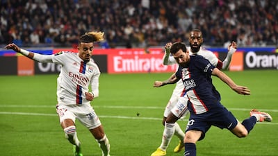 Lionel Messi takes a shot under pressure from Lyon's French defender Malo Gusto. AFP