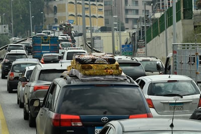People leave Beirut's southern suburbs after Israel warned of more strikes. EPA