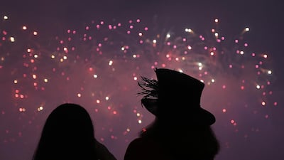 Racegoers enjoys the fireworks at the Dubai World Cup at the Meydan Racecourse in Dubai. ( Satish Kumar / The National )