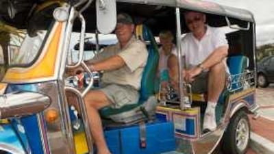 Jon athan Titley's company uses imported tuk-tuks to take tourists on trips around Knysna, in South Africa's Western Cape.