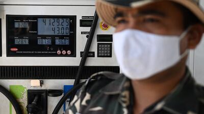 A security guard at a petrol station during protests by activists demonstrating against the recent price hike of fuel and diesel, in India's capital New Delhi. AFP