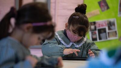 Pre-school children use their "Ceibalita tablets" during a class in a public school in Montevideo, Uruguay. AFP