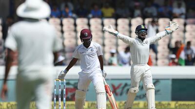 Indian wicketkeeper Rishabh Pant successfully appeals for the dismissal of West Indies' player Kieran Powell, bowled by Kuldeep Yadav, during the first day of the second cricket test match between India and West Indies in Hyderabad, India.