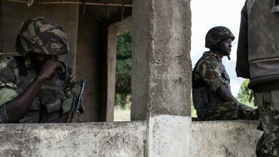 Mozambican Army soldiers stand at a checkpoint at the Vanduzi village in the Gorongosa area, Mozambique. AFP