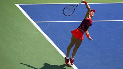Simona Halep of Romania serves the ball to Marina Erakovic of New Zealand in their first round match at the US Open Championships tennis tournament in New York, September 1, 2015. REUTERS/Carlo Allegri