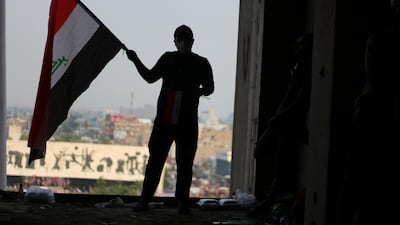 Mohamed al-Qaisy, 25, stands in the window of the Turkish restaurant building overlooking Tahrir Square. Pesha Magid