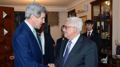 The Palestinian president, Mahmoud Abbas, right, meets the US secretary of state John Kerry on Saturday in Amman. Thaer Ghanaim / GPO via Getty Images