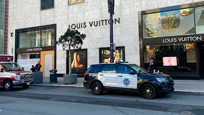 Police respond to a report of theft at the Louis Vuitton store in San Francisco's Union Square. AP
