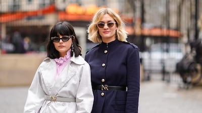 Chic winter street style at the Nina Ricci show in Paris this month - but those of us who live in the UAE don't often have a personal collection of the latest winter coats at hand. Sunglasses are a different story. Photo / Getty Images