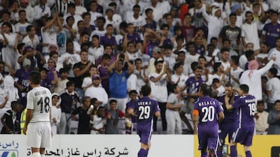 Al Ain Ain players celebrate after scoring a goal during their Asian Champions League group D football match against Uzbekistan's Nasaf club at the Hazza bin Zayed Stadium in Al-Ain on May 3, 2016. Al-Ain won the match 2-0. Karim Sahib / AFP