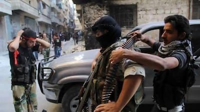 Free Syrian Army fighters prepare for an offensive against forces loyal to Bashar Al Assad in Aleppo's Salaheddine neighbourhood.