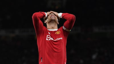 Manchester United's Portuguese striker Cristiano Ronaldo reacts to a missed chance during the English Premier League football match between Manchester United and Wolverhampton Wanderers at Old Trafford in Manchester, north west England, on January 3, 2022. (Photo by Paul ELLIS / AFP) / RESTRICTED TO EDITORIAL USE. No use with unauthorized audio, video, data, fixture lists, club/league logos or 'live' services. Online in-match use limited to 120 images. An additional 40 images may be used in extra time. No video emulation. Social media in-match use limited to 120 images. An additional 40 images may be used in extra time. No use in betting publications, games or single club/league/player publications. /