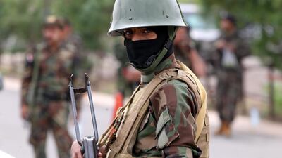 A Houthi militiaman keeps watch during protest in Sanaa, days after the brother of the rebel group’s leader Abdul-Malik Al Houthi was assassinated. EPA