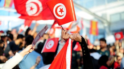Tunisia soccer fans gather to watch their national team play against France in a World Cup Group D soccer match played in Qatar, on a large screen set up for fans in Tunis, Tunisia. AP Photo
