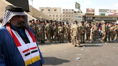 Iraqi policemen stand guard in central Baghdad. EPA