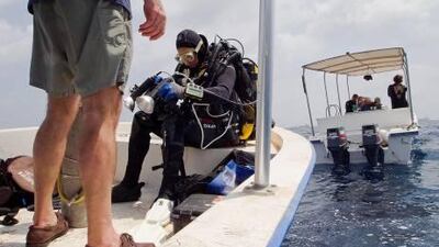 Deep diver Bill Leeman checks his gear before entering the water to explore a wreck of the Innes located 70 metres below the surface off the coast of Fujairah in May.