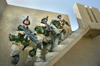 US soldiers clear abandoned houses of militants in 2004 during fighting in the Iraqi insurgent stronghold of Fallujah. Getty Images