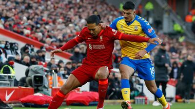 Liverpool defender Virgil van Dijk under pressure from Southampton's Armando Broja. Reuters