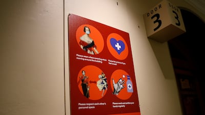 A welcome back sign requesting that people maintain precautions, is seen at the Royal Albert Hall in London, Britain, July 19, 2021