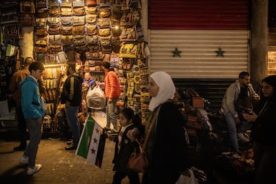 People shop in the Old City market in Damascus, Syria. Getty Images