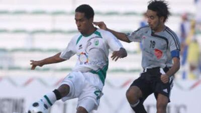 Al Shabab's Adel Abdullah Abbas, left, controls the ball under pressure from Mohammed Salim of Al Dhafra.