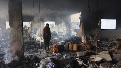 A Palestinian man inspects the damage at the site of an Israeli air strike on a building in Gaza city. AFP