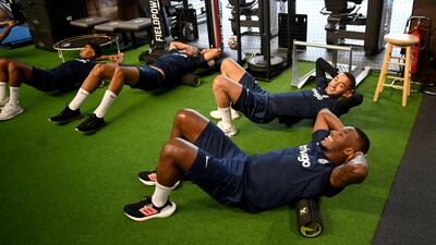Callum Hudson-Odoi and Hakim Ziyech during a warm up in the gym before a training session at Chelsea training ground.