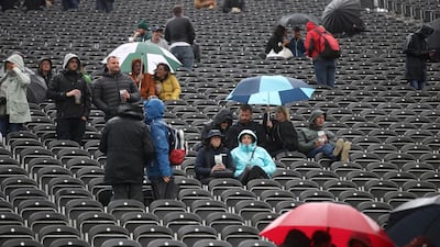Spectators with umbrella's during a rain delay on Day 1 of the fourth Ashes Test between England and Australia at Old Trafford, Manchester. Reuters