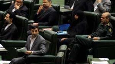 The Iranian president Mahmoud Ahmadinejad sits in front of a number of his cabinet nominees at a parliament session yesterday.