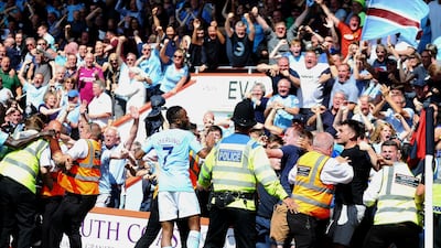Manchester City's Raheem Sterling celebrates with the crowd after scoring his side's winner against Bournemouth. Steve Paston / AP Photo