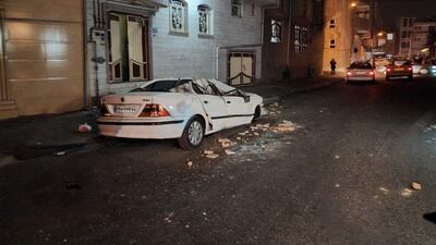 epa10437505 A handout picture made available by the Iranian Red Crescent Society shows a destroyed car on a street after an earthquake in the city of Khoy, Iran, 29 January 2023. A 5.9 magnitude earthquake hit north-western Iran late 28 January leaving three people dead and others injured according to Iranian Red Crescent society. EPA/IRANIAN RED CRESCENT HANDOUT EDITORIAL USE ONLY/NO SALES