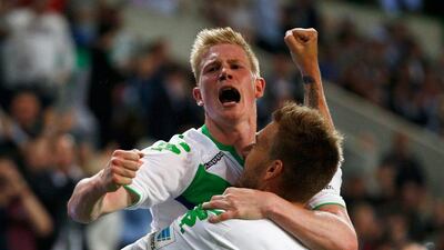 Nicklas Bendtner celebrates with Wolfsburg teammate Kevin De Bruyne after scoring the equaliser in the German Cup. Dean Mouhtaropoulos / Getty Images