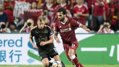 Liverpool's Mohamed Salah fights for the ball with Leicester City's Marc Albrighton. Victor Fraile / Getty Images