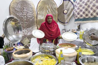 Umm Khammas exhibits her home made dishes at Fujairah exhibition. Reem Mohammed / The National