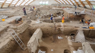 Researchers excavate the ruins of Catalhoyuk, a prehistoric settlement located in south-central Turkey. Scott Haddow/Reuters.