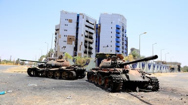 A view of damaged tanks in front of the Central Bank of Sudan building in Khartoum. Reuters