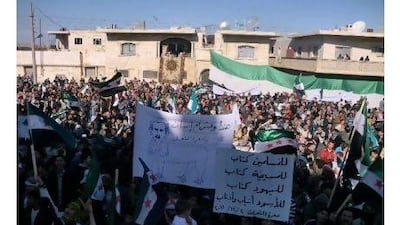 Protests in Syria, such as this one last Friday, are still being met with government-sponsored violence, despite the regime's fine promises, readers note. Reuters