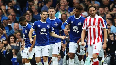 Leighton Baines, centre, took the penalty that rebounded off the post onto Shay Given that earned Everton victory against Stoke City. Ian MacNicol / Getty Images
